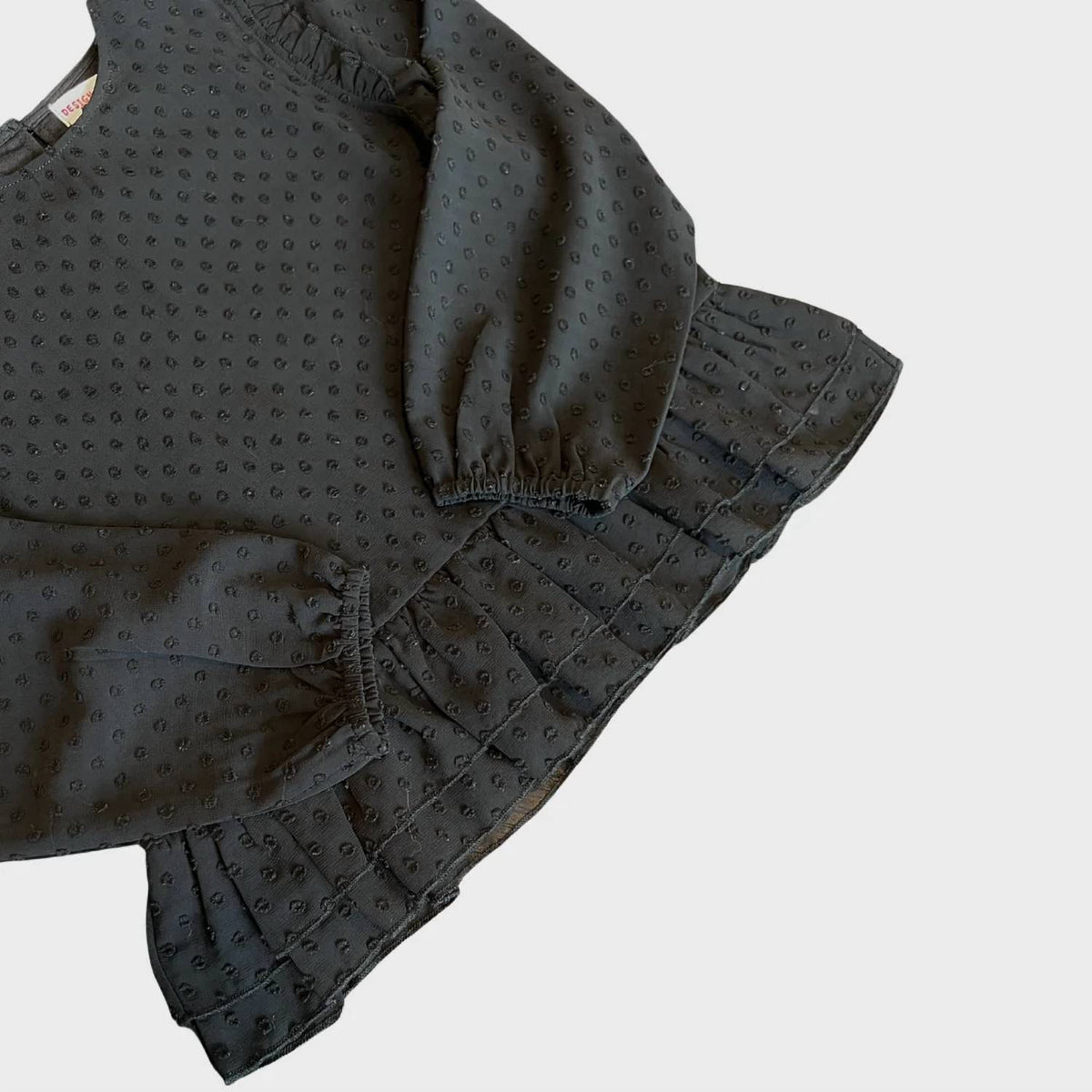 Women's 3D Dot Ruffled Bottom Top In Black